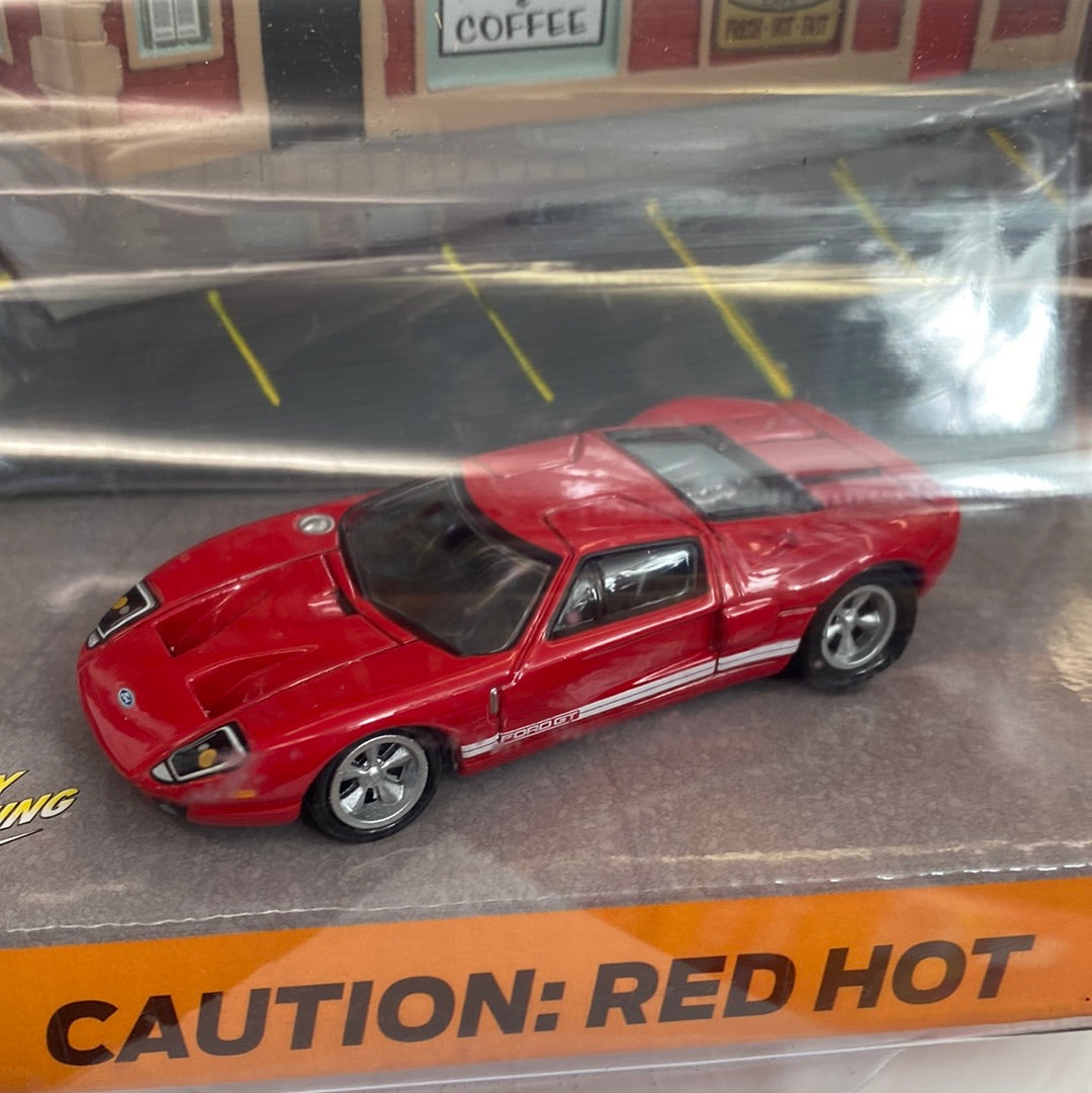 Red Ford GT sports car toy on display for Johnny Lightning JLDR004R