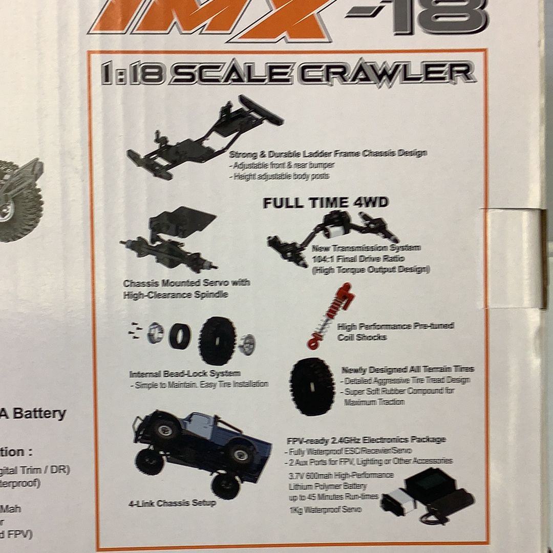 Crawler chassis details showing suspension, drivetrain, and electronics components for IMX IMX25005