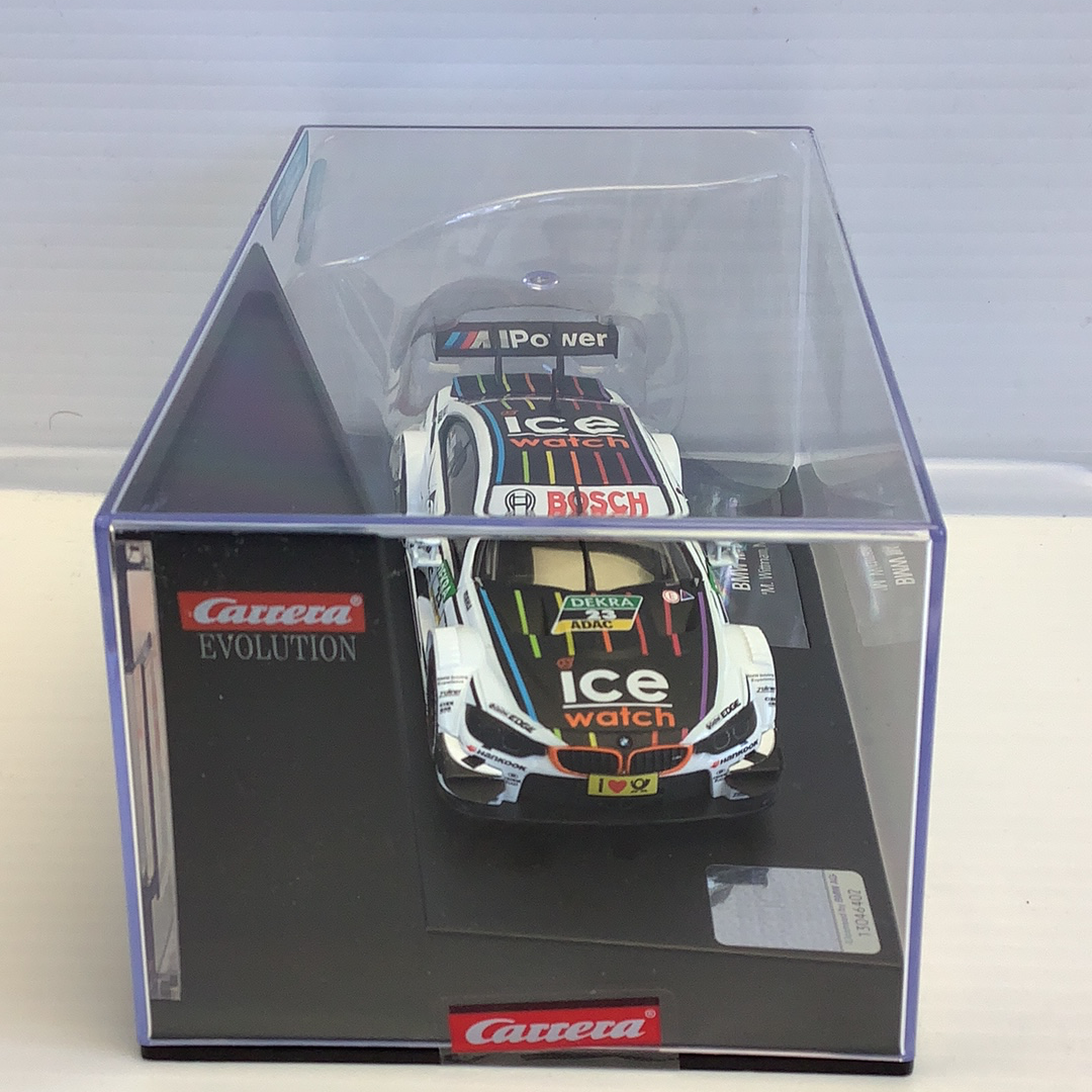 Slot car of a BMW M4 DTM race car in its display box for Carrera Evolution 27499
