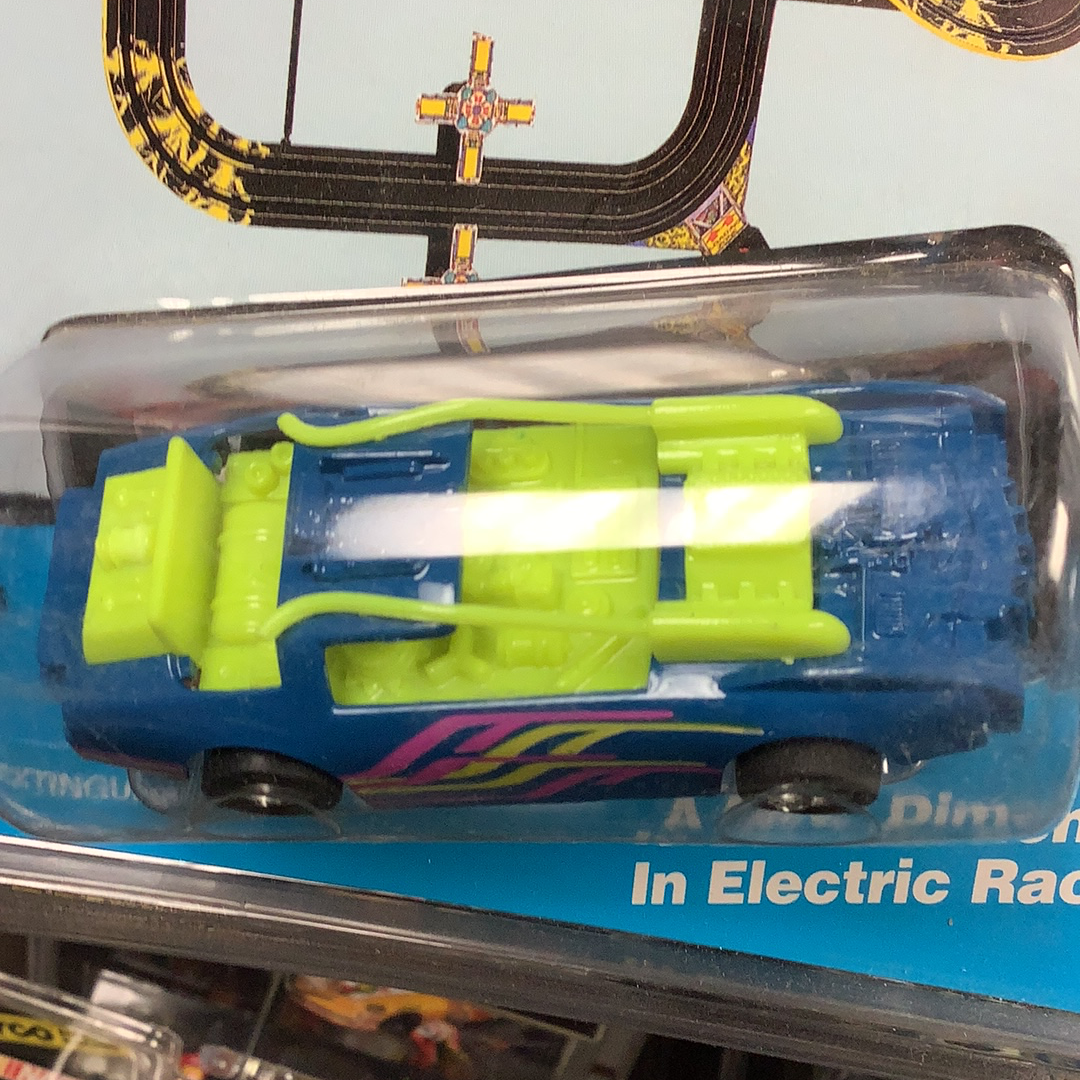 Blue and yellow toy race car with a bright green ladder-like attachment for Tyco 6494 Turbo Extinguisher