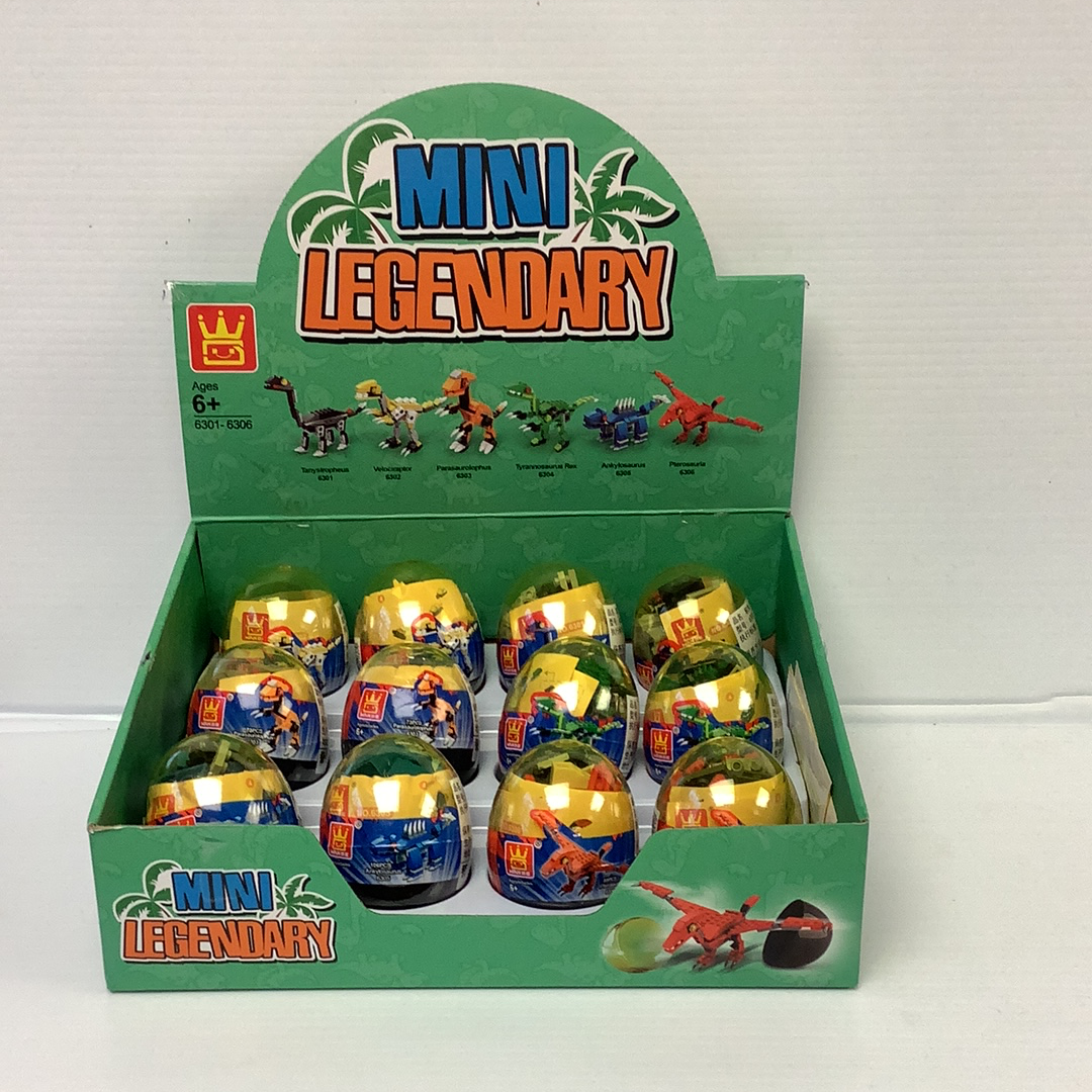 Assortment of small, colorful dinosaur-themed toy eggs in a green box for IMEX Model Company WAG63016