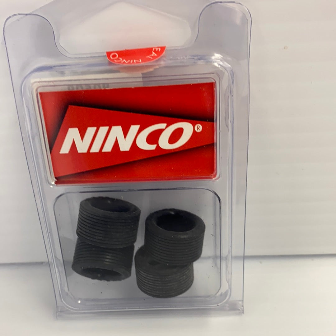 Set of four black, ribbed tires in clear plastic packaging for NINCO 80508