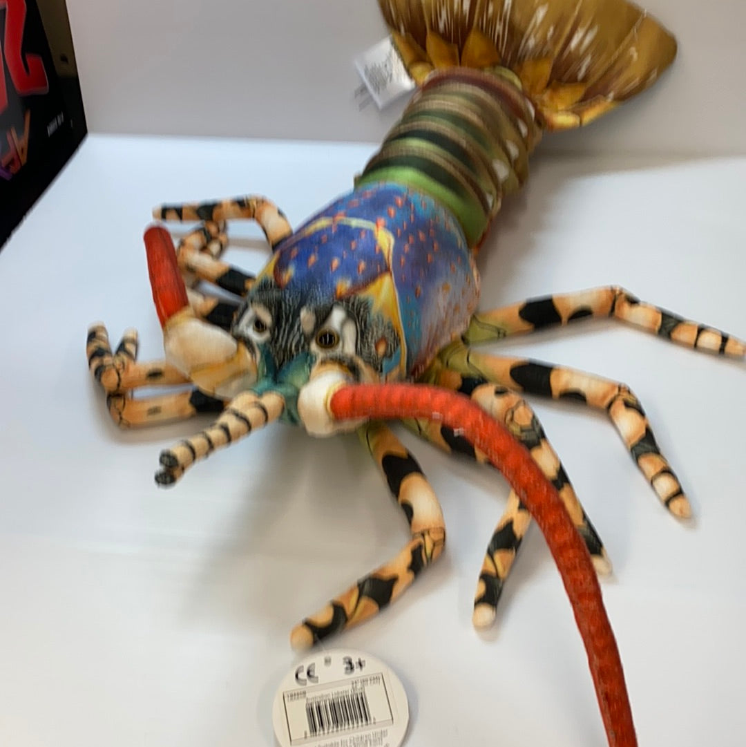 Stuffed toy lobster with blue and yellow coloring, displayed on white surface for Real Planet LB60B