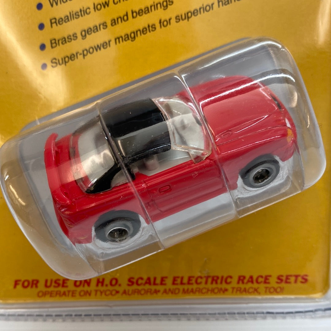 Red slot car Ford Mustang race car in clear plastic packaging for Life-Like Racing Max-Traxx 9736