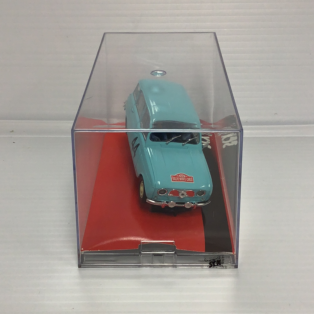 Slot car of a light blue 1963 Renault 4L Montecarlo car in a display case for SCX A10070X3U0