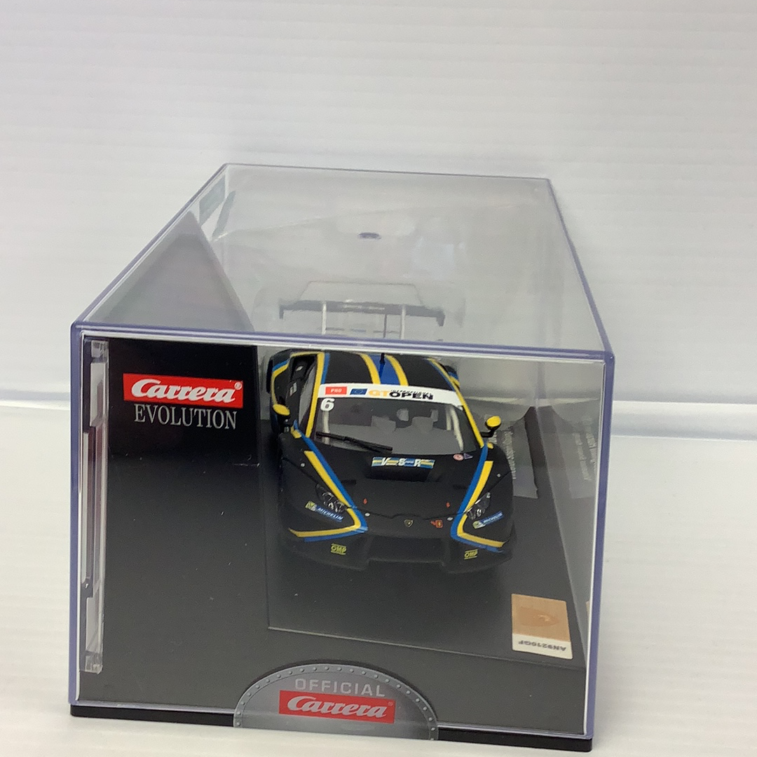 Black Lamborghini Huracan GT3 race car model in a display case for Carrera 27595