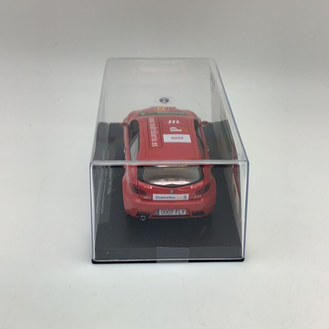Red slot car in clear display case for Fly Car 96046