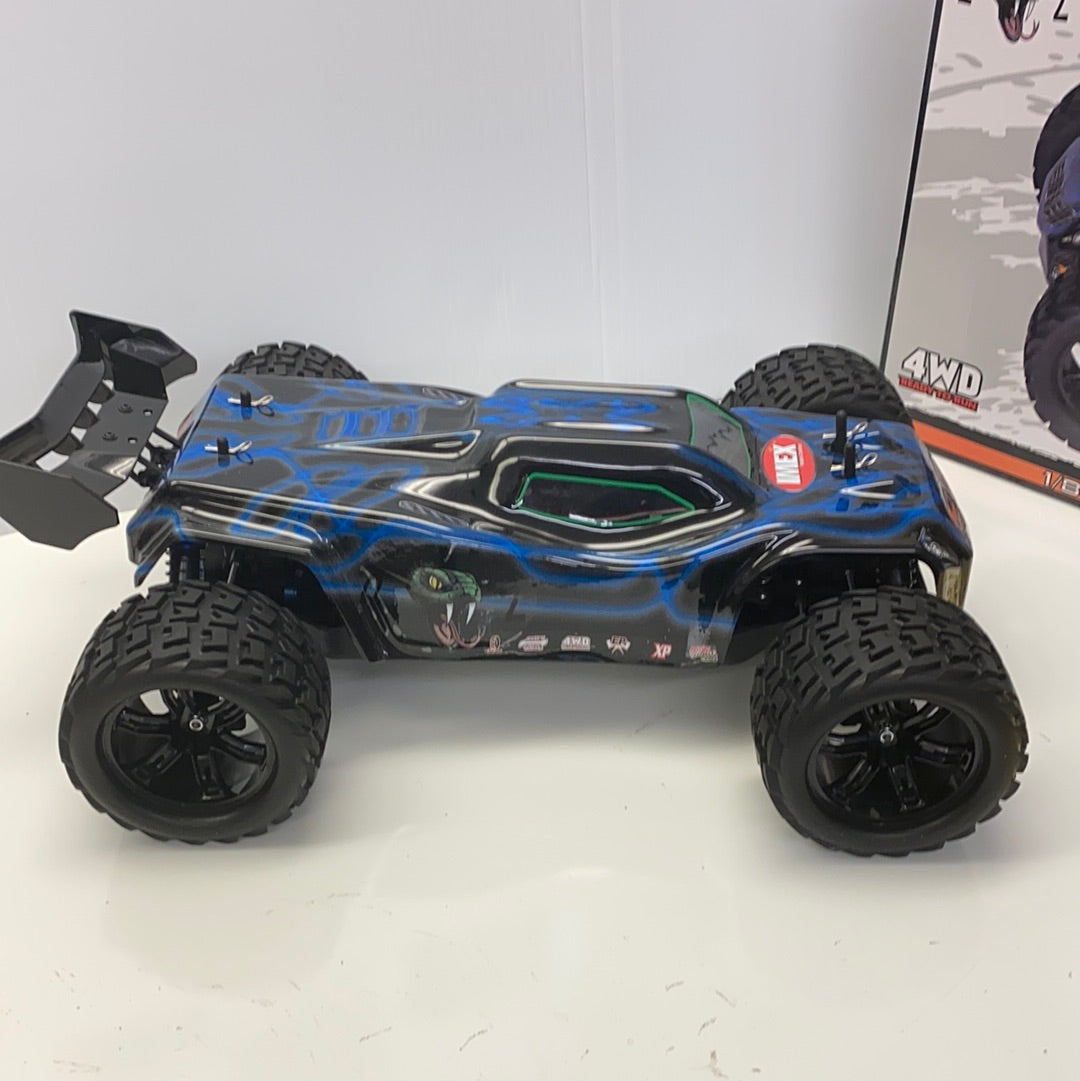 Black and blue remote-controlled truggy with large off-road tires for IMEX 22005, front view