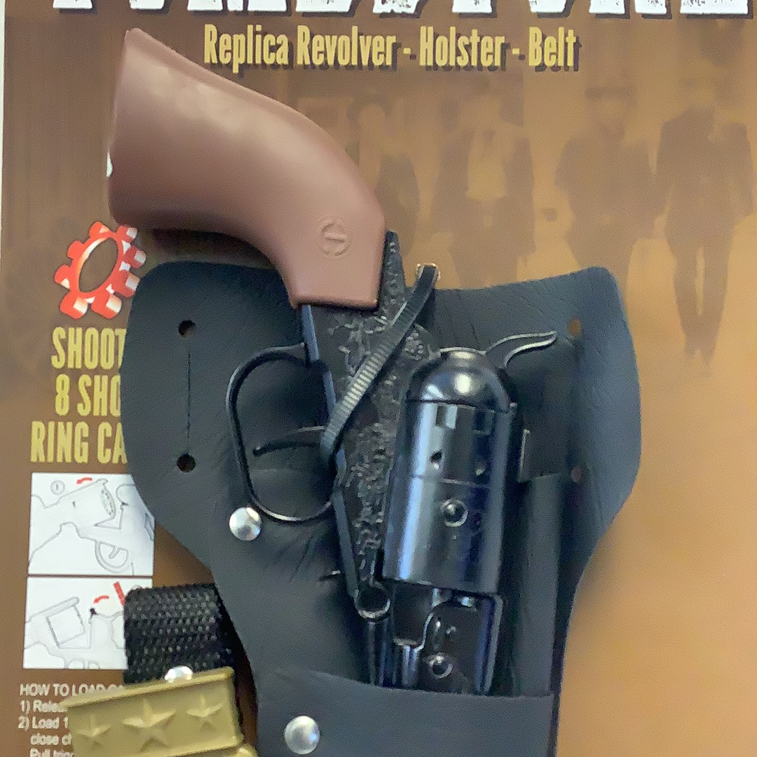 Revolver and holster set displayed on a brown background for Parris Toys 4712