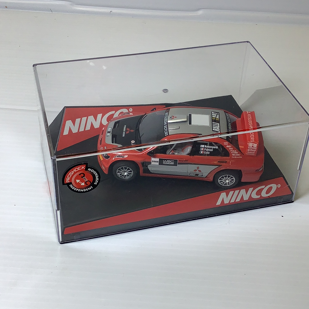 Red and black Mitsubishi WRC show car model in clear plastic box for NINCO 50394