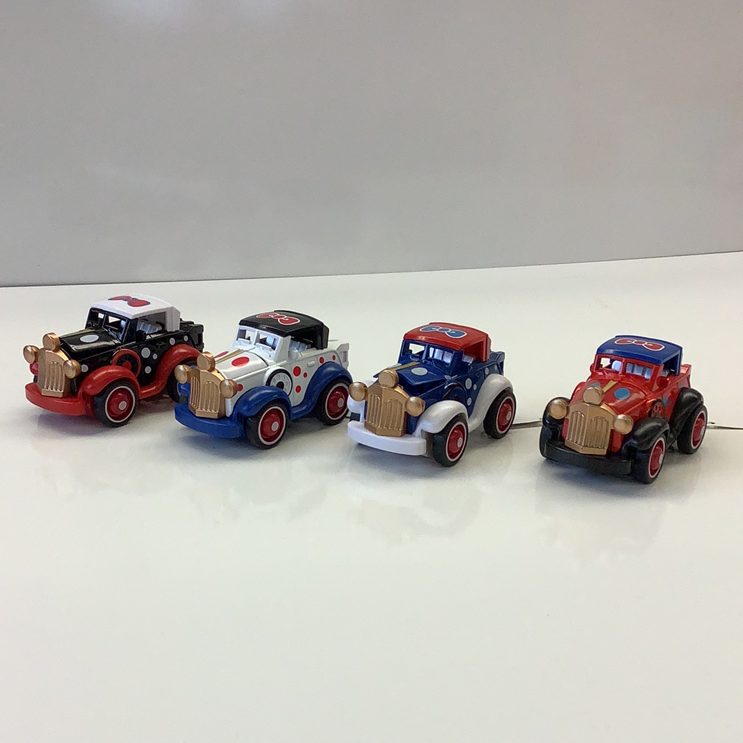 Four vintage die-cast police cars lined up on a white surface for IMEX-Toys 88433TY