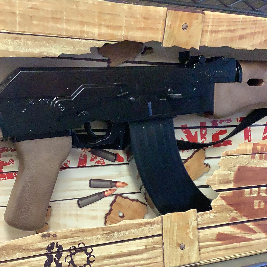 Black AK-47 assault rifle with wooden crate background for Gonher 137/6
