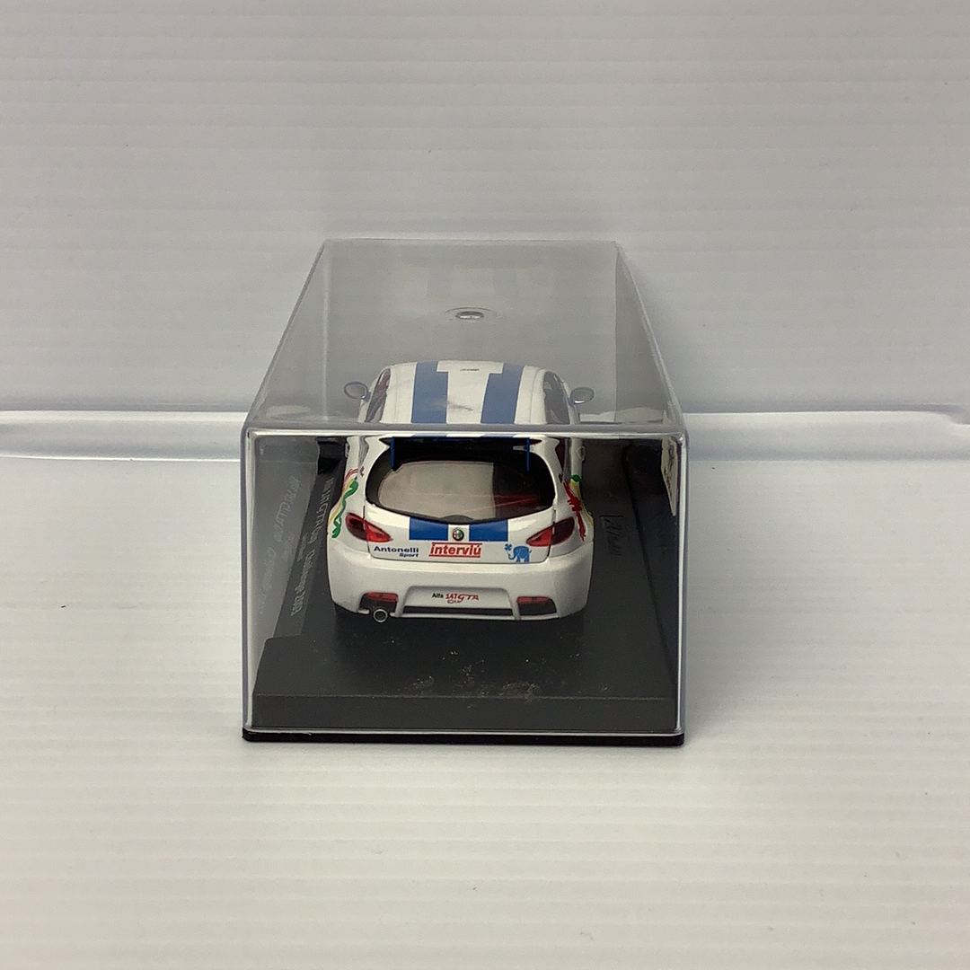 Slot car of a white Alfa 147 GTA race car in a clear display case for Fly Car 88082