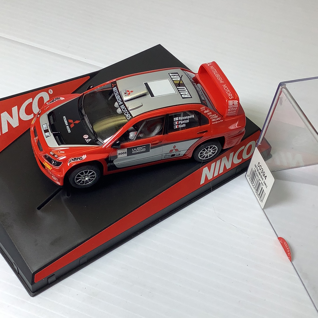 Red Mitsubishi WRC show car model on display base for NINCO 50394