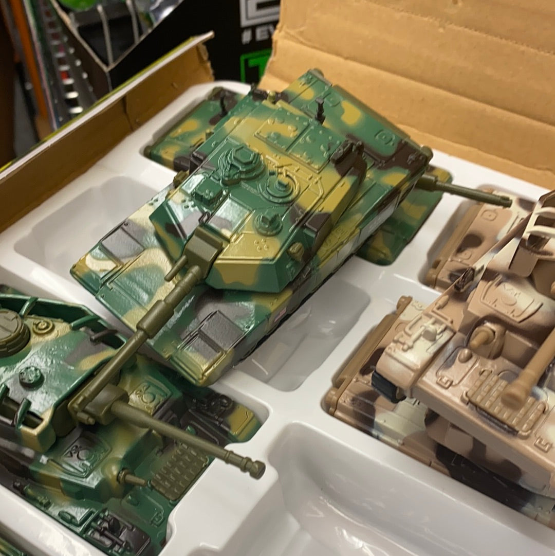 Toy tanks in a box, showing various military vehicle models for Toy Smith 2531