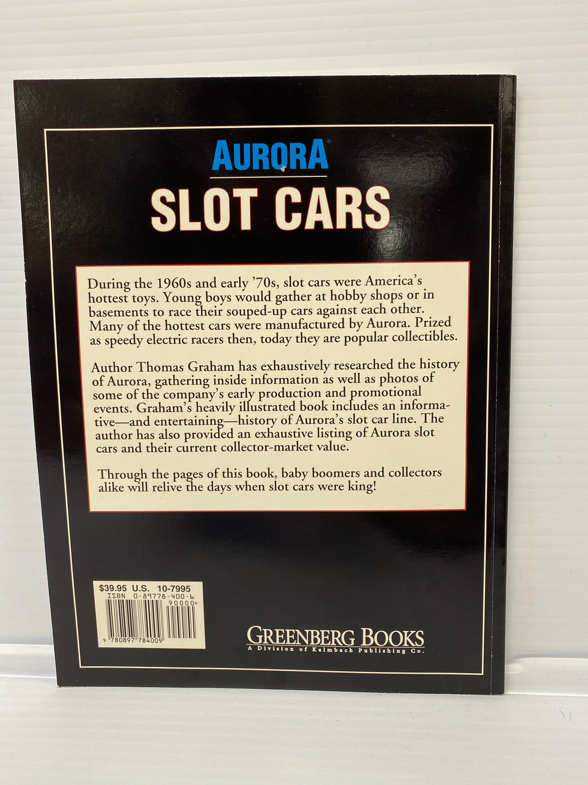 Book cover: Aurora Slot Cars history guide by Thomas Graham for 9000