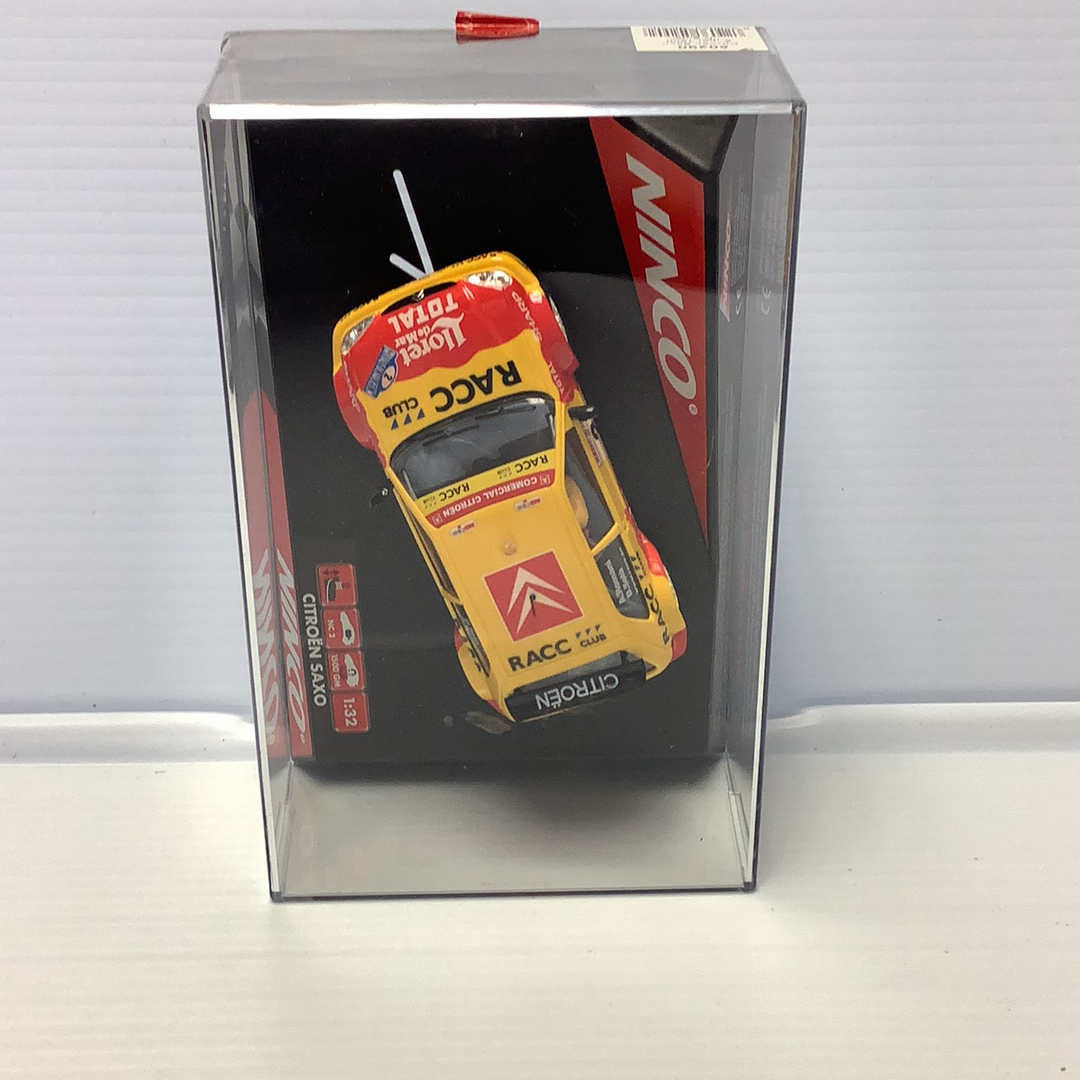 Slot car of a yellow Citroen Saxo race car for Ninco 50290, rear view