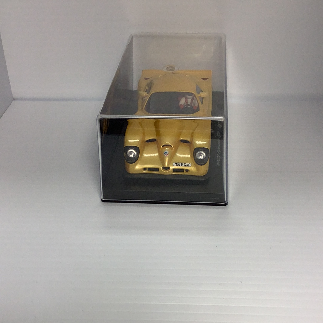 Yellow slot car in a clear display case for Fly Car A66, display case view, product view 2