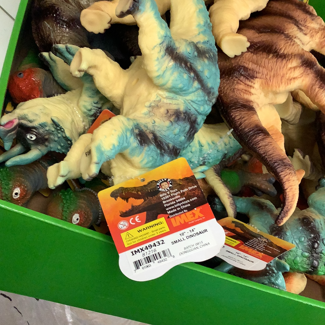 Assortment of plastic dinosaur toys in various poses and colors for Schylling IMX49432