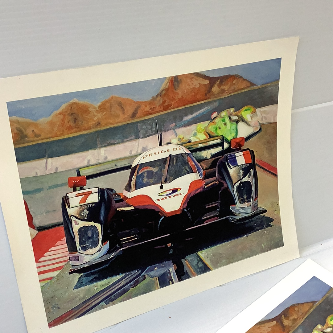 Slot car race car on track with distant mountains under a blue sky for Timothy W. Young 11”x14”, alternate track view