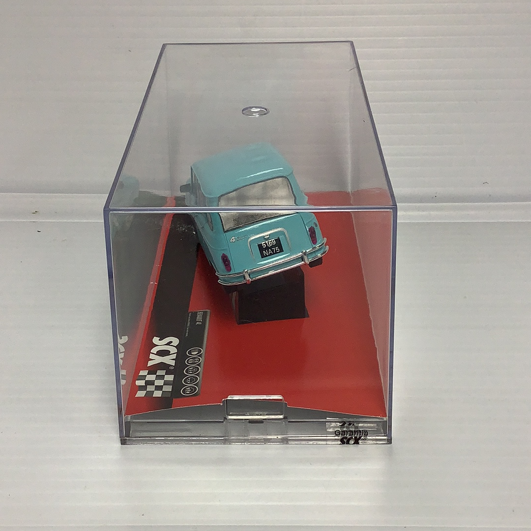 Slot car of a 1963 Renault 4L Montecarlo in a clear display case for SCX A10070X3U0