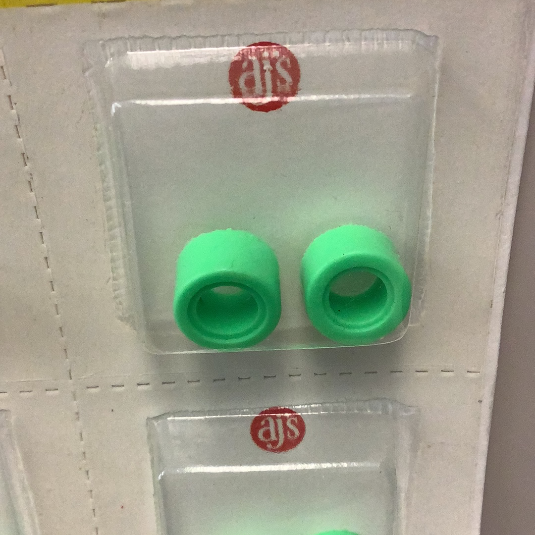 Two bright green silicone rings in a clear plastic packaging tray for Gum Drops Silicone Day-Glo Green Tires 017