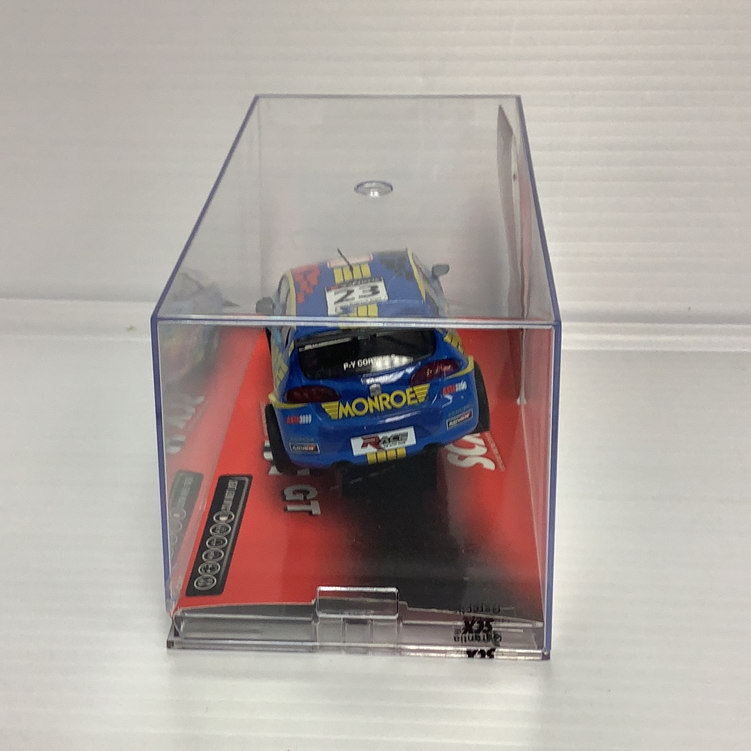 Blue and yellow slot car replica of a Leon WTCC race car for SCX 63100