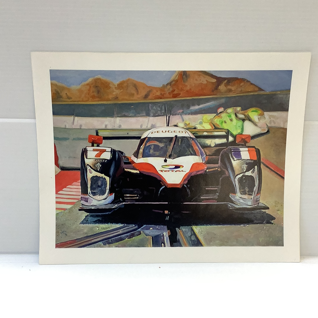 Slot car race cars on a track with distant mountains under a blue sky for Timothy W. Young 11”x14”