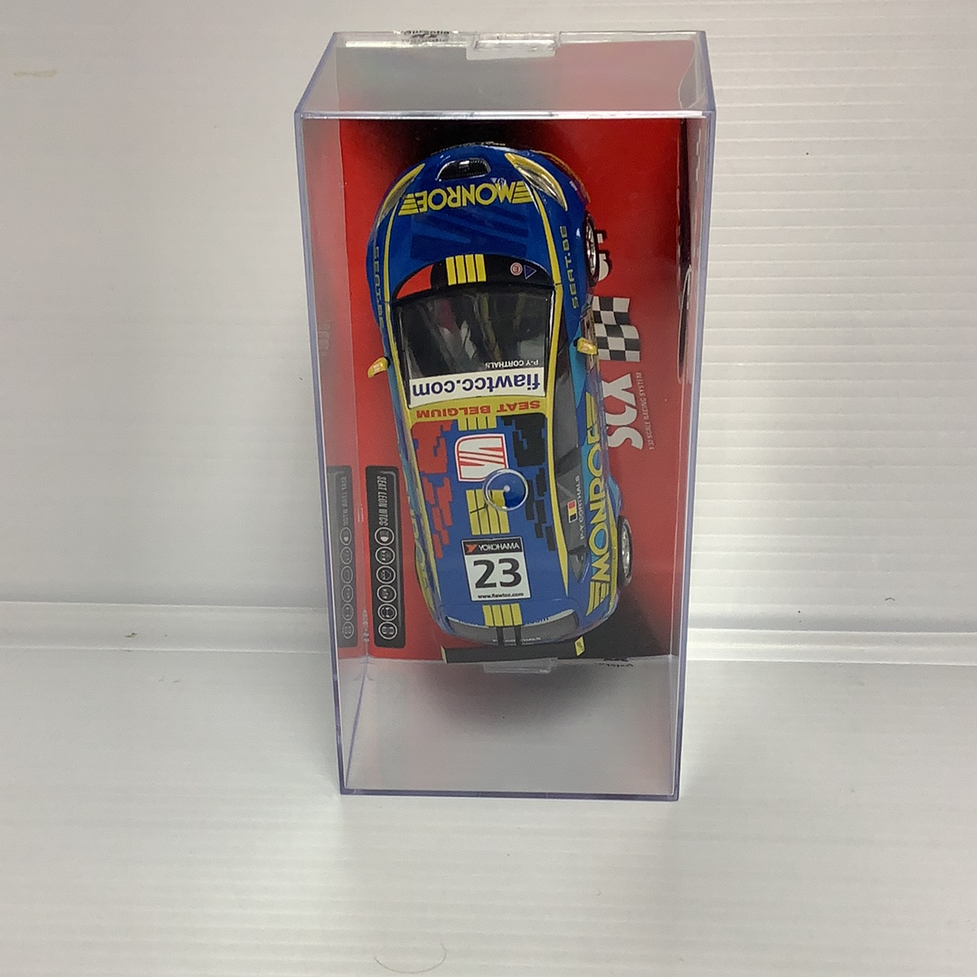 Blue and yellow slot car model of a Seat Leon WTCC race car for SCX 63100