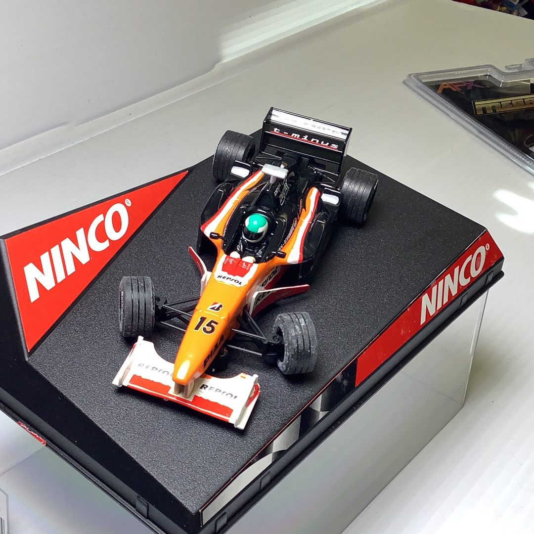 Orange and black race car toy on its branded box for Ninco 50212