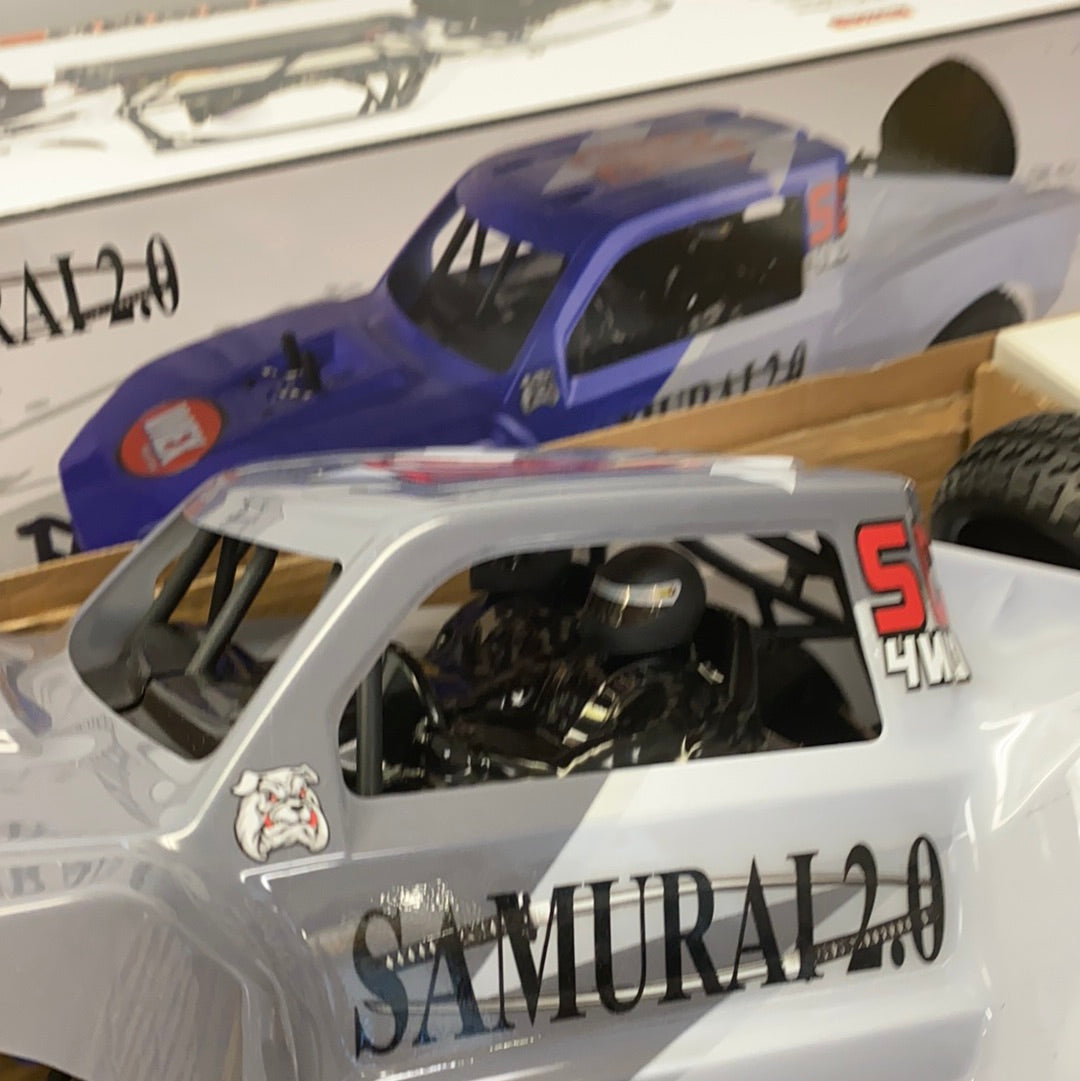 Gray remote-controlled car with "SAMURAI 2.0" visible on the front for IMEX 22010