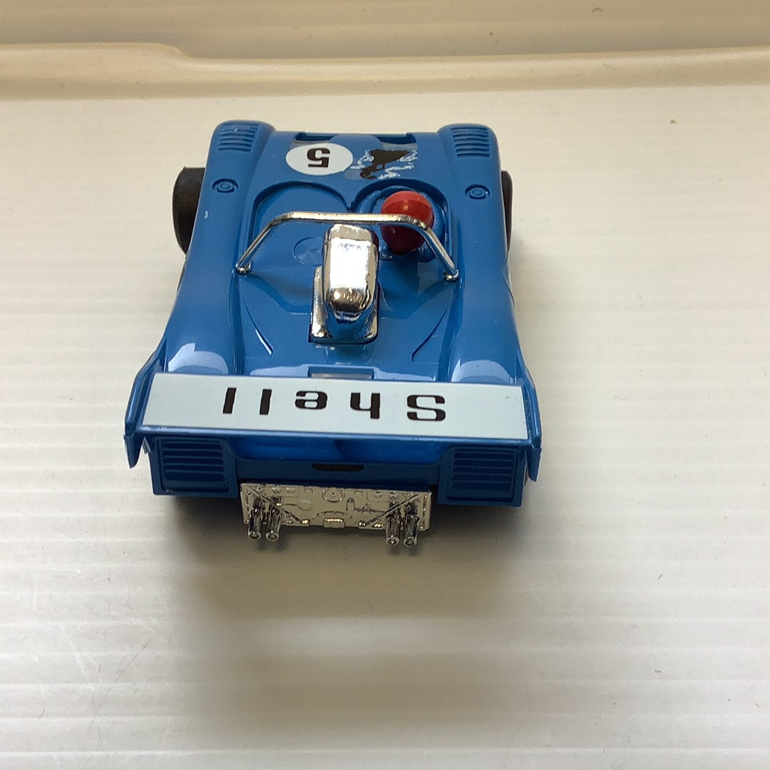 Blue toy race car with "Shell" lettering on the bottom for Polistil Evolution A.105