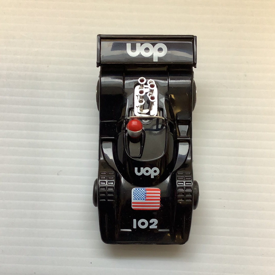 Black UOP Shadow model car with American flag decal and "102" marking for REH Polistil A.108