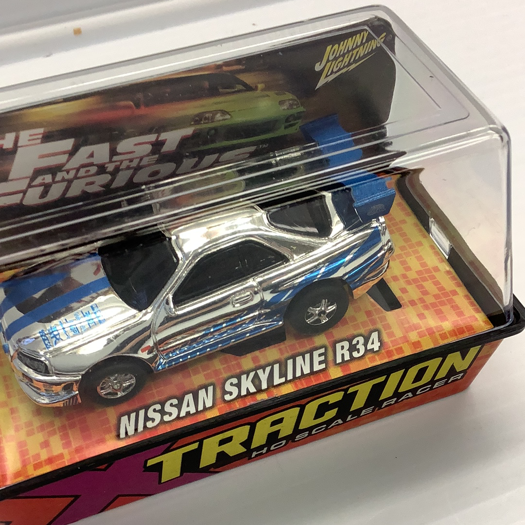 Silver Nissan Skyline R34 slot car in clear plastic case for Johnny Lightning 39503