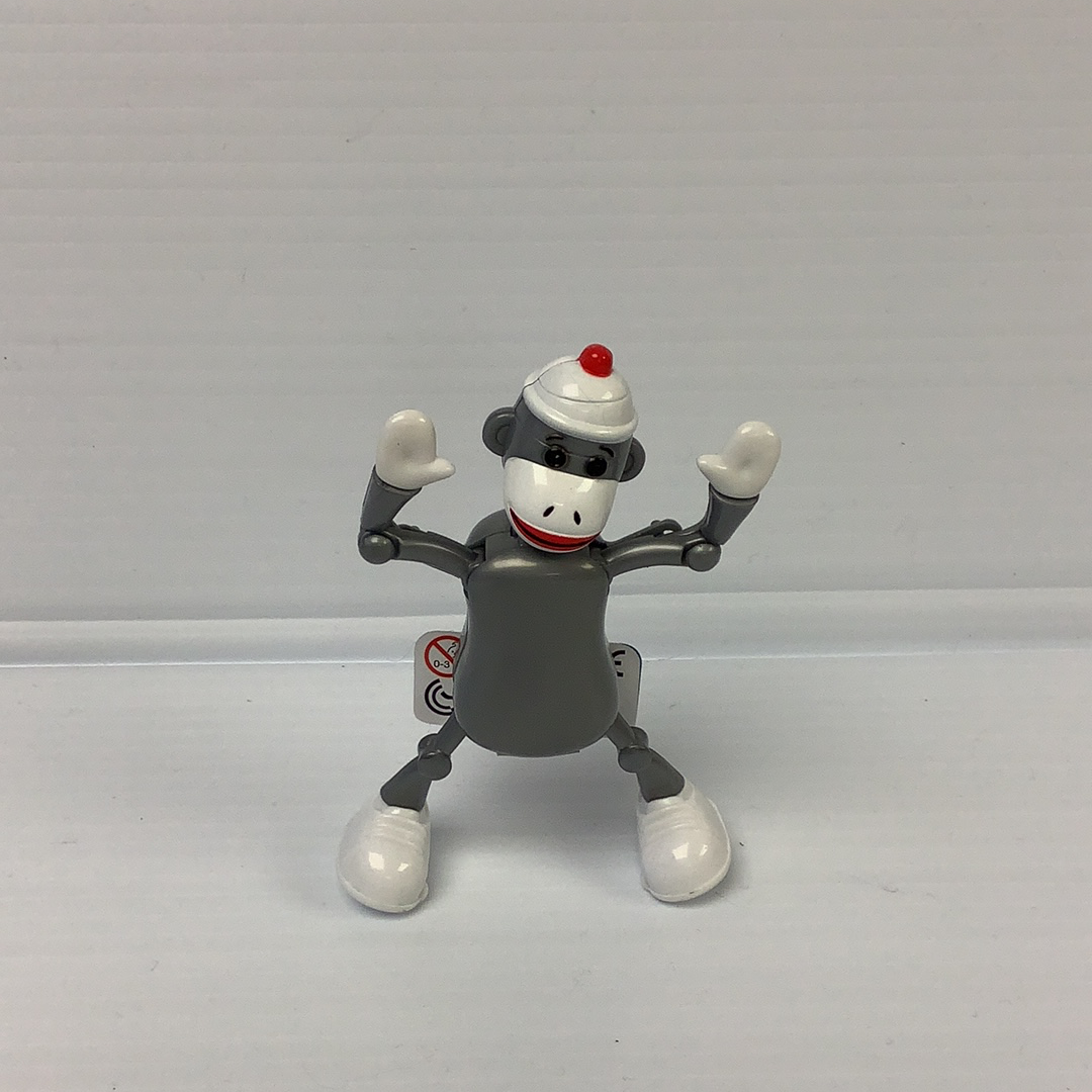 Sock monkey toy figure with arms raised, standing on a white surface for California Creations 75167, front view