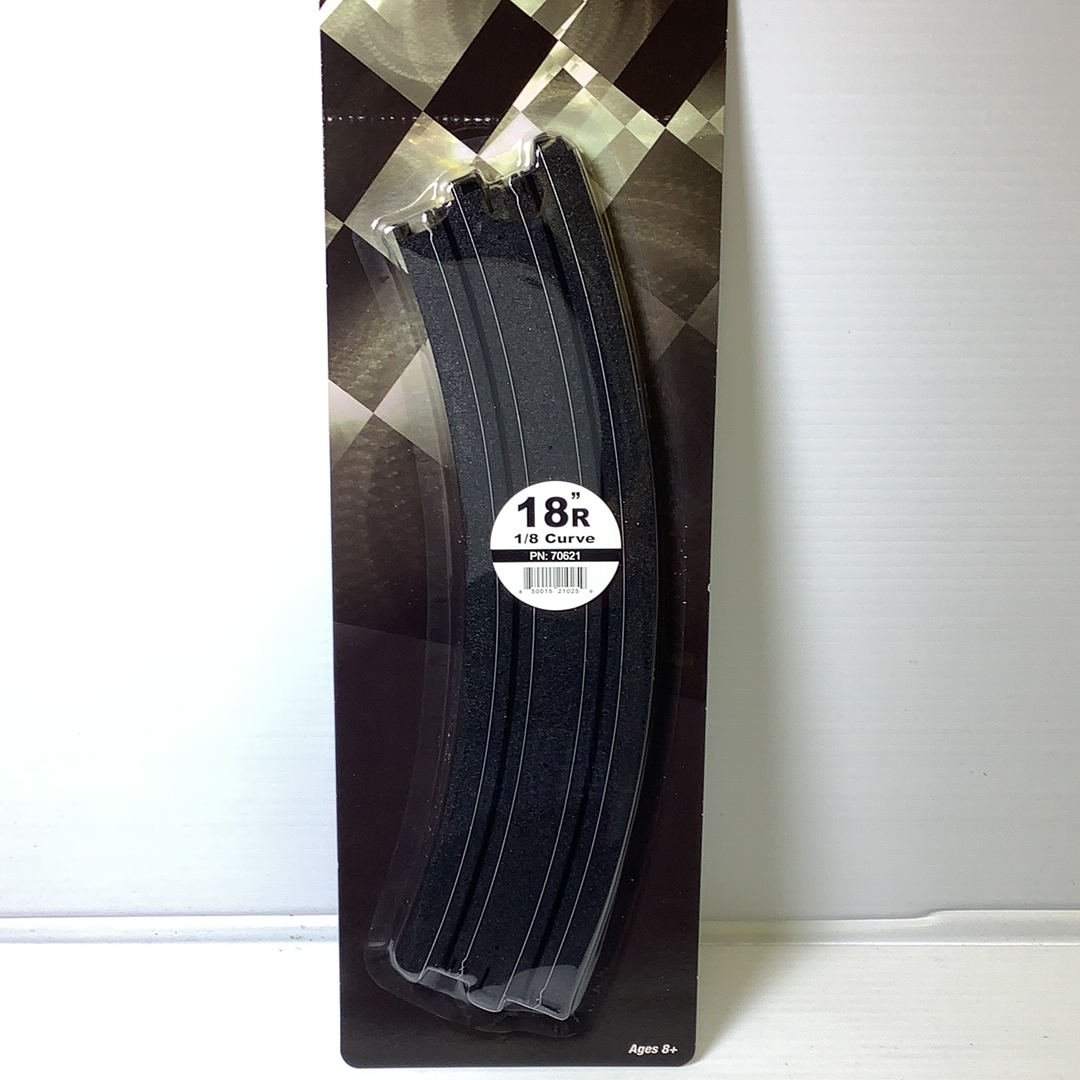Black, curved race track pieces on a patterned cardboard backing for AFX RaceMaster 70621