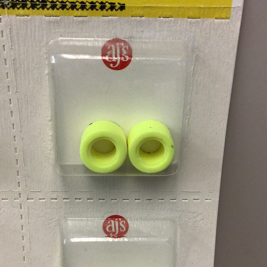 Two bright yellow silicone tires displayed in clear packaging for Gum Drops Silicone Day-Glo Yellow Tires 016