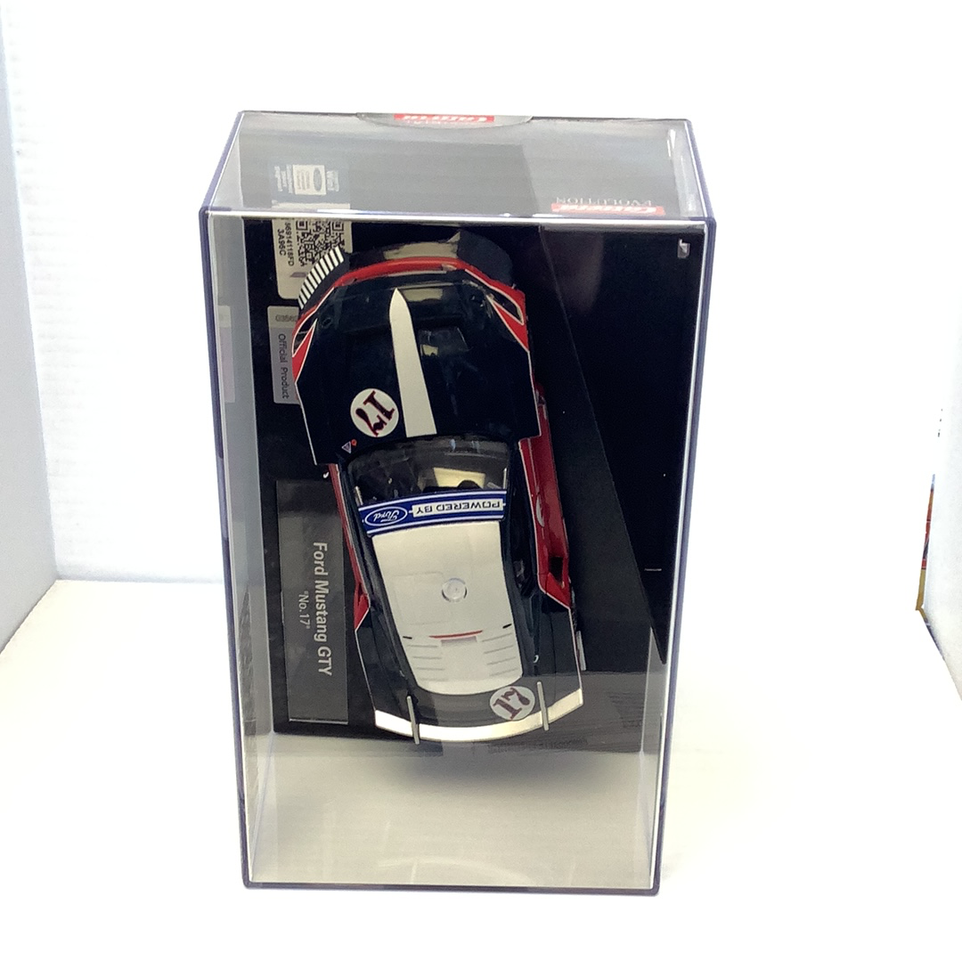 Slot car of a black and red Ford Mustang GTY race car in its box for Carrera Evolution 27636