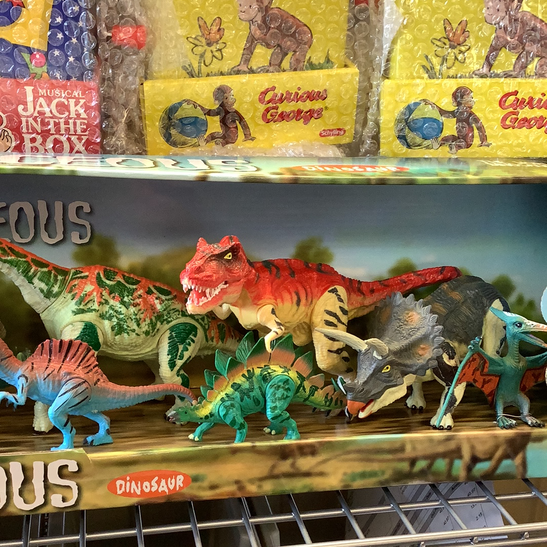 Assortment of colorful dinosaur toys, including T-Rex, Triceratops, and Stegosaurus figures for 12 dinosaurs 49010