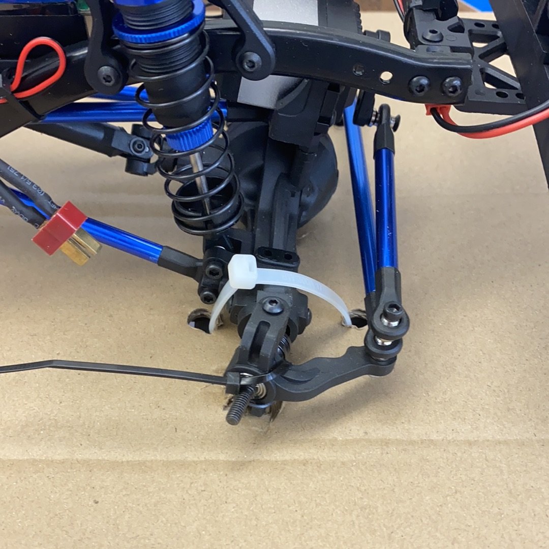 Crawler truck suspension components with blue springs and black plastic parts for IMEX 22025