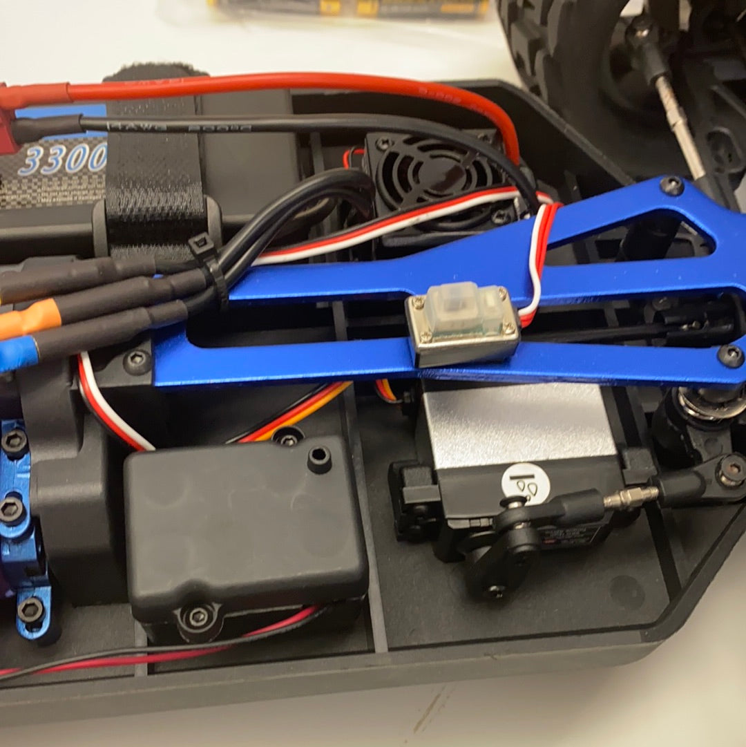 RC car electronics: motor, battery, and blue metal arm assembly for IMEX 22005