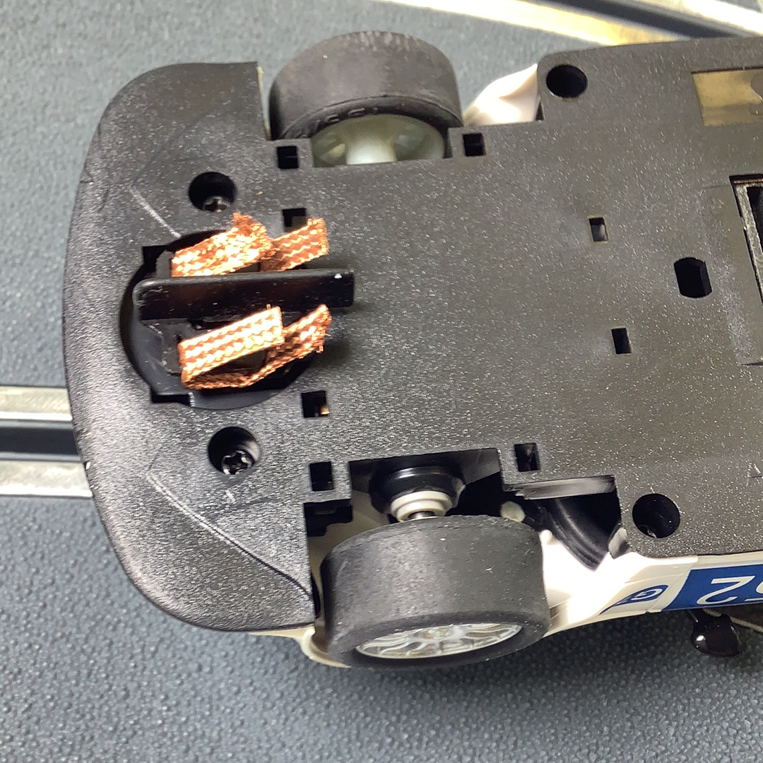 Close-up view of a model car's front section showing internal details for SCX A10304X3U0