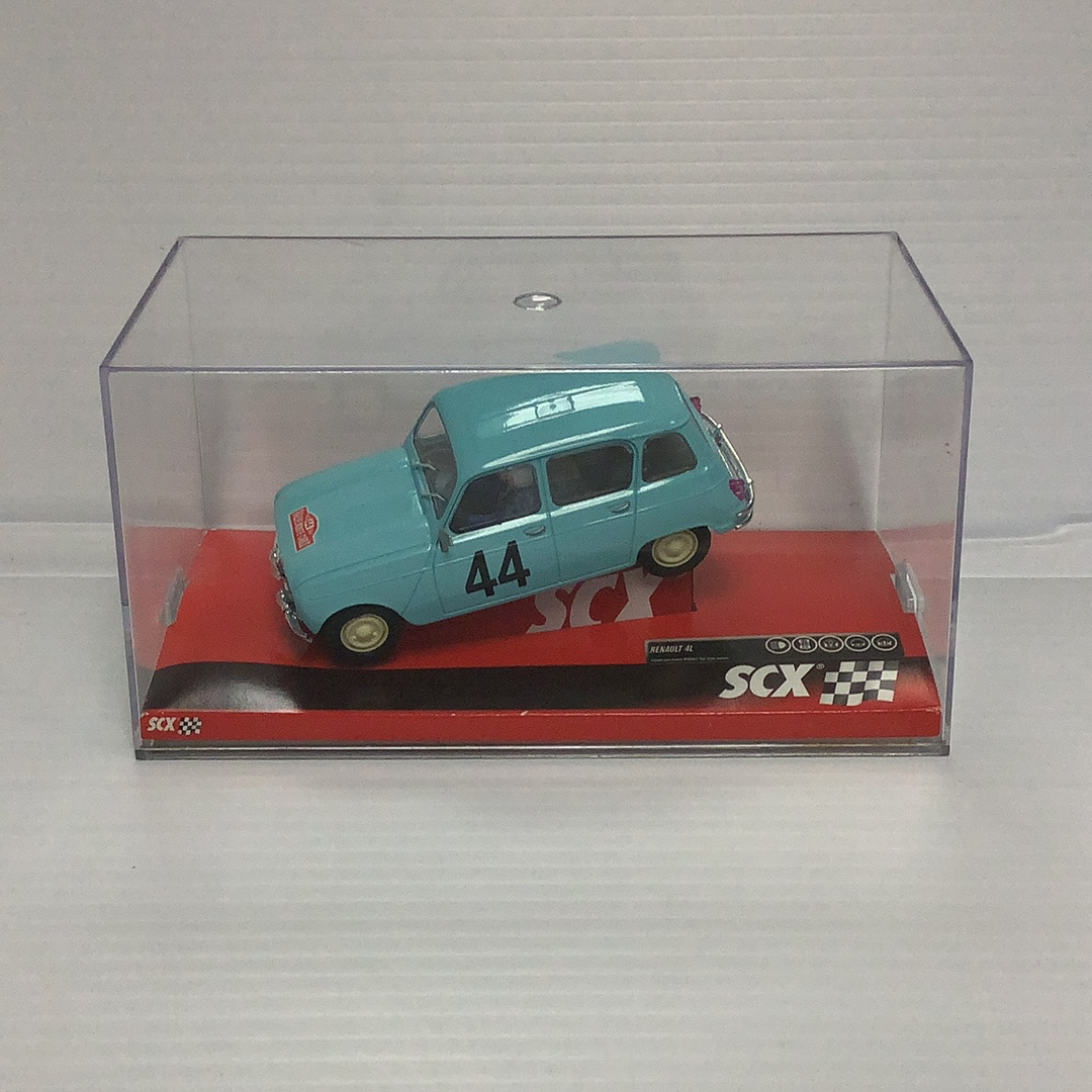 Small blue slot car, Renault 4L, displayed in a clear case for SCX A10070X3U0