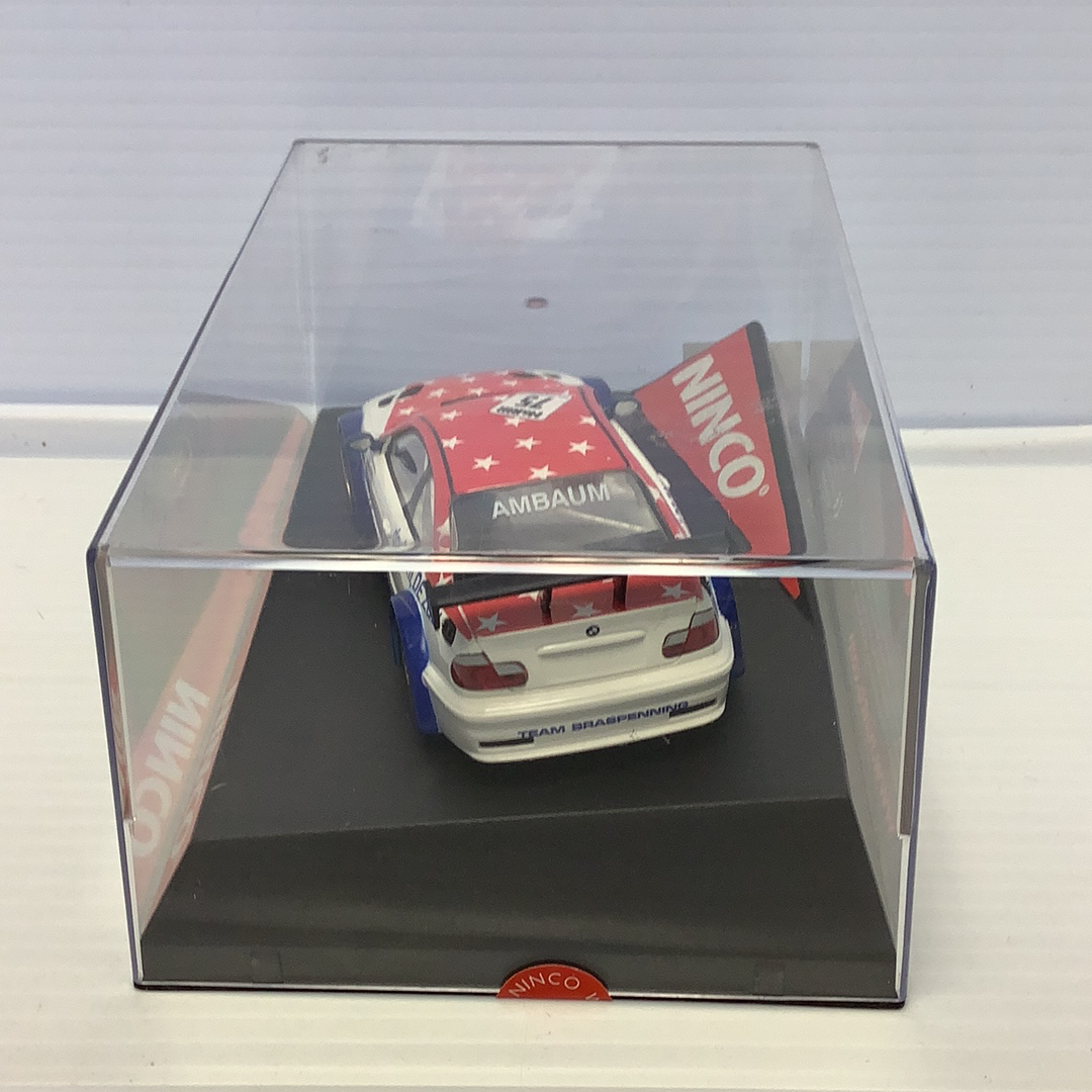 Red and white BMW M3 GTR race car in clear display case for Ninco 50307