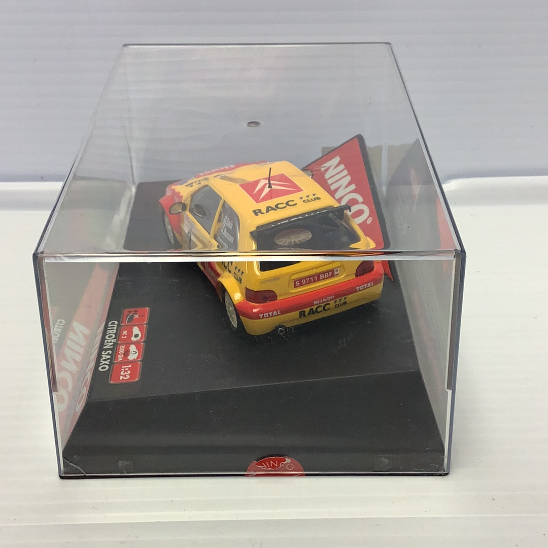 Yellow slot car model of a Citroen Saxo Super 1600 for Ninco 50290