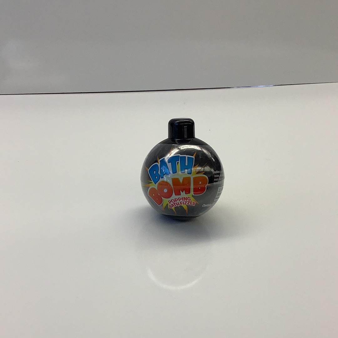 Black bath bomb with colorful "BATH BOMB" text on a white surface for Schylling BATHB