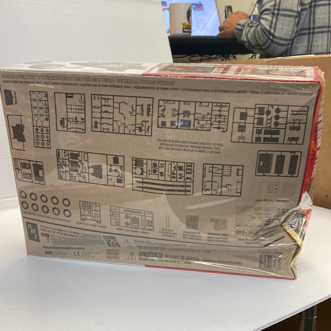 Model kit box art showing parts layout for a semi-tractor for Round2 AMT1160