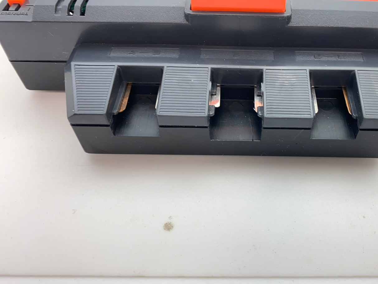 Control center with four flag slots, black and orange plastic for Aurora Tomy AFX Vintage 8639