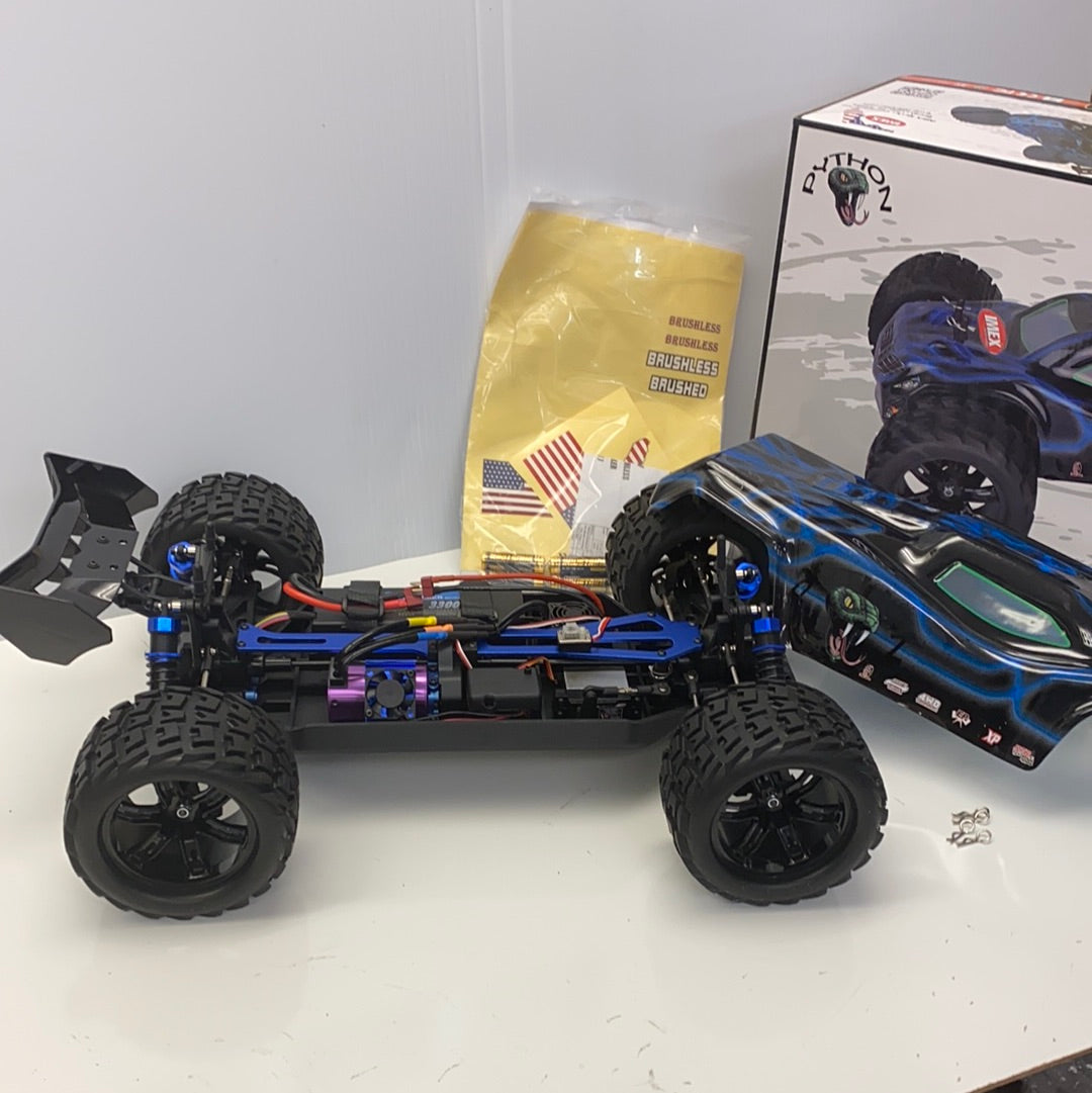 Remote-controlled truggy with large tires and blue/black body for IMEX 22005