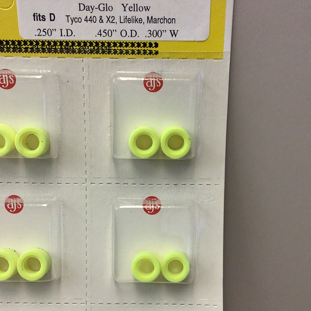 Yellow silicone tire rings in various sizes, packaged for sale for Gum Drops Silicone Day-Glo Yellow Tires 016